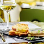 Tasty foie Gras with toasts and glass of white wine at a restaurant Foie gras paris